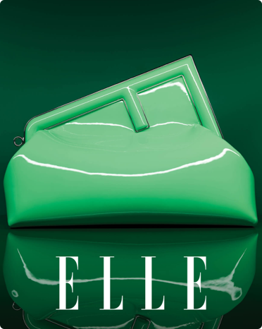 The cover of Elle featuring an image of a mint green clutch handbag.