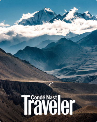 The cover of Condé Nast Traveler featuring an image of a mountain range.